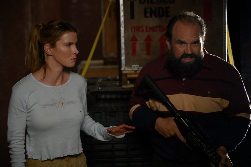 Betty Gilpin and Ethan Suplee in The Hunt